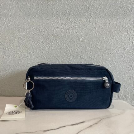 KIPLING Deep Blue Minimalist Makeup Bag - Fashionable Silver Zipper, Elegant Travel Companion“
